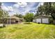 Expansive backyard featuring extra garage/storage space for added convenience and functionality at 6920 Newman E Cir, Lakeland, FL 33811
