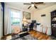 Bedroom featuring natural light, hardwood floors, and a comfortable workspace, creating a functional and inviting atmosphere at 6920 Newman E Cir, Lakeland, FL 33811