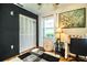Bedroom featuring sound dampening wall, rug, and a window with natural light at 6920 Newman E Cir, Lakeland, FL 33811