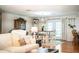 A combined dining and living room area provides seamless space for entertainment and dining at 6920 Newman E Cir, Lakeland, FL 33811
