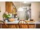 Eat-in kitchen featuring wooden cabinets, stainless appliances, and island seating at 6920 Newman E Cir, Lakeland, FL 33811