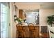 View of open eat-in kitchen and breakfast bar from dining area at 6920 Newman E Cir, Lakeland, FL 33811
