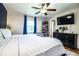 Bedroom featuring a ceiling fan, large tv, and natural light at 6920 Newman E Cir, Lakeland, FL 33811