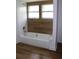 Updated bathroom with a tub and shower featuring modern fixtures at 701 1St Ne St, Fort Meade, FL 33841