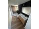 Bathroom featuring a stylish wood vanity with double sinks, modern fixtures, and a spacious shower area at 701 1St Ne St, Fort Meade, FL 33841