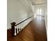 Bright entryway featuring staircase and hardwood flooring at 701 1St Ne St, Fort Meade, FL 33841