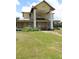 Charming two-story home with metal roof, large columns, and wraparound porch at 701 1St Ne St, Fort Meade, FL 33841