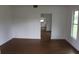 Spacious living room with hardwood floors, neutral paint, and plenty of natural light at 701 1St Ne St, Fort Meade, FL 33841