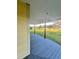 Exterior shot of a long porch with wood floor and view of the lawn at 701 1St Ne St, Fort Meade, FL 33841