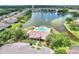 Aerial view of the community amenities like pool and cabana area near a fountain pond at 7770 Lake James Blvd, Lakeland, FL 33810