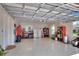 View of the garage with speckled flooring, storage, and plenty of space for vehicles at 7770 Lake James Blvd, Lakeland, FL 33810