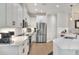 Bright kitchen features stainless appliances, white cabinets, and a breakfast bar at 7770 Lake James Blvd, Lakeland, FL 33810