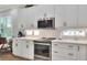 Updated kitchen with stainless steel appliances and white cabinetry at 7770 Lake James Blvd, Lakeland, FL 33810