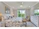 Relaxing main bedroom with large window, soft lighting and soothing color palette at 7770 Lake James Blvd, Lakeland, FL 33810