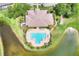 Aerial view of the community pool, offering shaded seating, lounge chairs, and access to the lake at 7770 Lake James Blvd, Lakeland, FL 33810