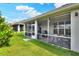 View of the home's outdoor screened-in patio perfect for entertaining friends and Gathering at 7770 Lake James Blvd, Lakeland, FL 33810