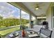 Spacious screened porch with outdoor dining and grilling areas, perfect for entertaining and enjoying outdoor living at 7770 Lake James Blvd, Lakeland, FL 33810