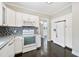 Updated kitchen featuring white appliances, granite countertops, and plenty of storage at 783 E Central Ave, Eagle Lake, FL 33839