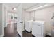 Laundry room with washer and dryer and an open view to an adjacent room at 783 E Central Ave, Eagle Lake, FL 33839