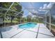 Enclosed pool area with seating area, mature trees, and an open sky view at 783 E Central Ave, Eagle Lake, FL 33839
