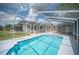 Screened-in pool with clear blue water and plenty of room for lounging at 783 E Central Ave, Eagle Lake, FL 33839