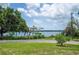 Scenic water views from the lush green lawn add to the property's appeal at 783 E Central Ave, Eagle Lake, FL 33839