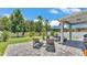 Well manicured backyard with lush landscaping, a patio area with lots of seating, and a privacy fence at 8120 Soldierwood St, Winter Garden, FL 34787