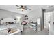 Bedroom with a ceiling fan, a cozy chair, and a desk with storage at 8120 Soldierwood St, Winter Garden, FL 34787