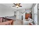 Bedroom with a changing table, armchair, and Peter Pan wall decor at 8120 Soldierwood St, Winter Garden, FL 34787