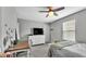 Bedroom featuring a ceiling fan, a window and a desk with storage at 8120 Soldierwood St, Winter Garden, FL 34787