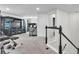 Large bonus room with carpeted floors and a staircase at 8120 Soldierwood St, Winter Garden, FL 34787