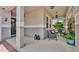 Covered front porch featuring a seating area with comfortable chairs and stylish outdoor decor at 8120 Soldierwood St, Winter Garden, FL 34787