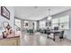 Spacious living area with tile floors, modern lighting, and turquoise seating at 8120 Soldierwood St, Winter Garden, FL 34787