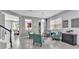 Comfortable living area showcasing tile flooring, contemporary lighting, and a view to the kitchen at 8120 Soldierwood St, Winter Garden, FL 34787