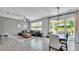 The living area has tile floors and opens to the dining area and patio, creating a seamless indoor-outdoor living space at 8120 Soldierwood St, Winter Garden, FL 34787