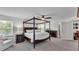Large main bedroom features a four-poster bed, ceiling fan, and carpet floors at 8120 Soldierwood St, Winter Garden, FL 34787