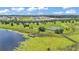 Aerial view of a neighborhood park including a fishing pier and tennis courts at 8120 Soldierwood St, Winter Garden, FL 34787