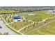 Aerial view of community park with playgrounds, picnic tables, and walking paths at 8120 Soldierwood St, Winter Garden, FL 34787