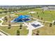 Aerial view of community park with playgrounds, picnic tables, and walking paths at 8120 Soldierwood St, Winter Garden, FL 34787