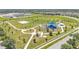 Aerial view of community park with playgrounds, picnic tables, and walking paths at 8120 Soldierwood St, Winter Garden, FL 34787