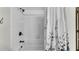 Shower featuring white tiled walls and a shower curtain at 8120 Soldierwood St, Winter Garden, FL 34787