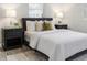 Cozy bedroom featuring a comfortable bed with plush pillows, side tables, lamps, and neutral decor creating a calming retreat at 906 E Lowell St, Lakeland, FL 33805