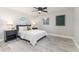 Comfortable bedroom with neutral colors, wood-look floors and modern decor at 906 E Lowell St, Lakeland, FL 33805