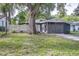 Landscaped front yard and charming exterior create a welcoming entrance to this single Gathering residence at 906 E Lowell St, Lakeland, FL 33805
