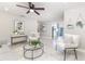 Bright living room with stylish decor, comfortable seating, and seamless flow to adjacent rooms at 906 E Lowell St, Lakeland, FL 33805