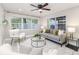 Cozy living room featuring stylish furniture, natural light, and a ceiling fan at 906 E Lowell St, Lakeland, FL 33805