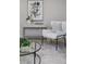 A modern living room featuring sleek furniture, artwork, and a light color palette at 906 E Lowell St, Lakeland, FL 33805