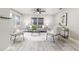 Bright living room with neutral paint, modern furnishings, and a large window at 906 E Lowell St, Lakeland, FL 33805