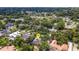 Aerial shot of property surrounded by mature trees in a suburban neighborhood at 1018 E Highland Dr, Lakeland, FL 33813