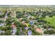 Wide aerial view of a suburban neighborhood filled with mature trees at 1018 E Highland Dr, Lakeland, FL 33813